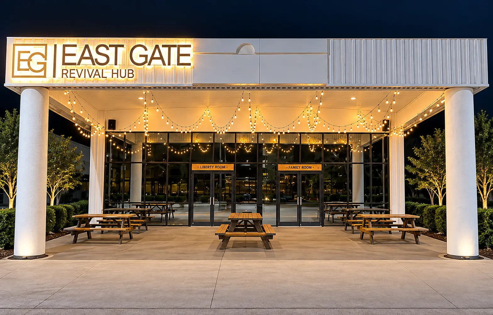 East Gate Revival Hub building entrance lit at night